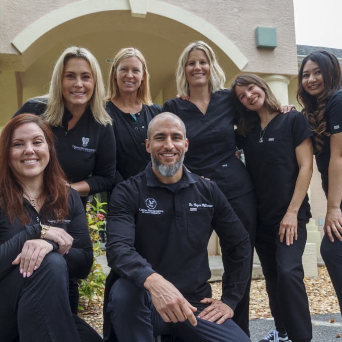 Two friendly dental team members in dental treatment room