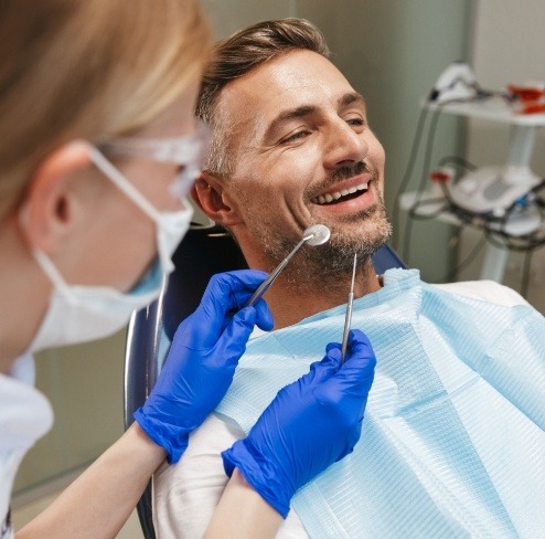 Man smiling during dental bonding treatment