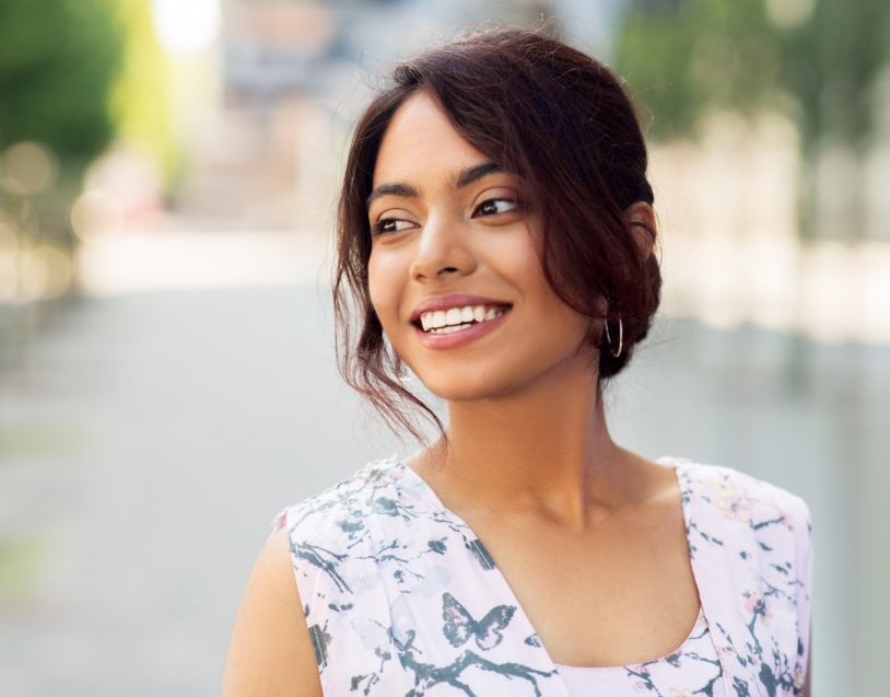 Woman smiling after dental checkup and teeth cleaning visit