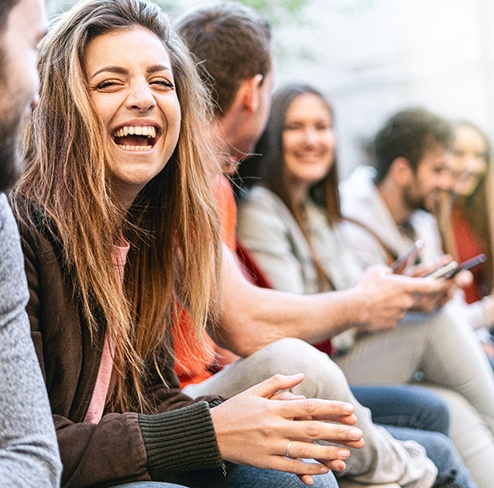 Port Charlotte patient laughing with friend after ClearCorrect