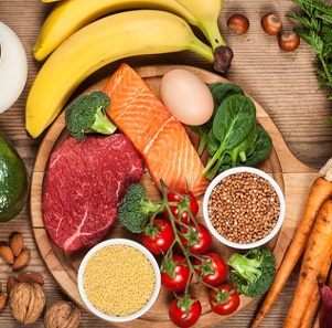 Various foods spread out on wooden table