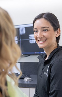 Smiling woman sitting in dental chair