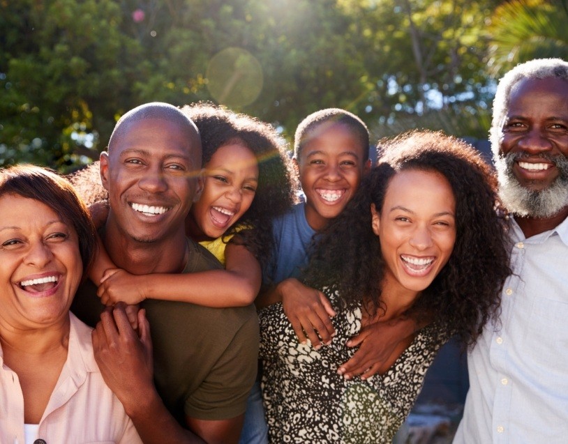 Three generations of family smiling together