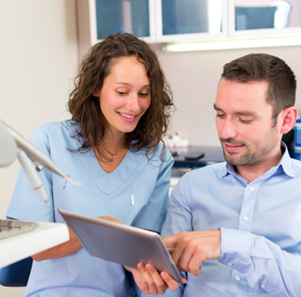 Patient in Port Charlotte talking to dentist about dental implants