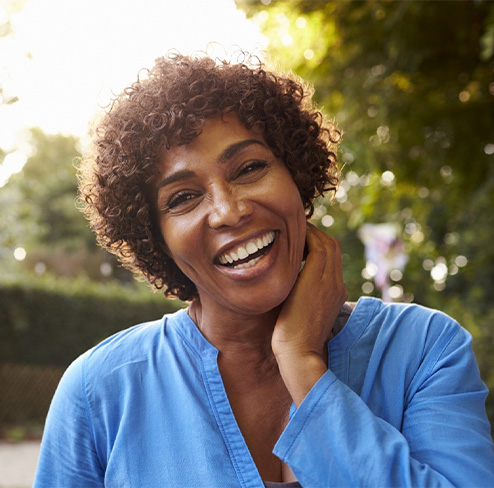 Man and woman with dentures smiling