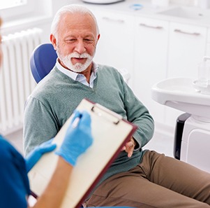 a dentist consulting with a patient about sedation