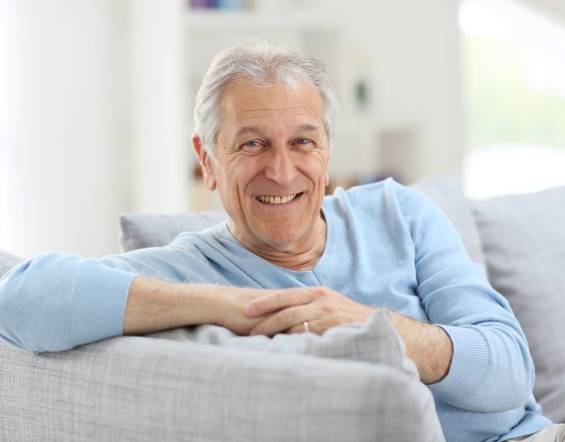 Man sharing healthy smile after oral cancer screening