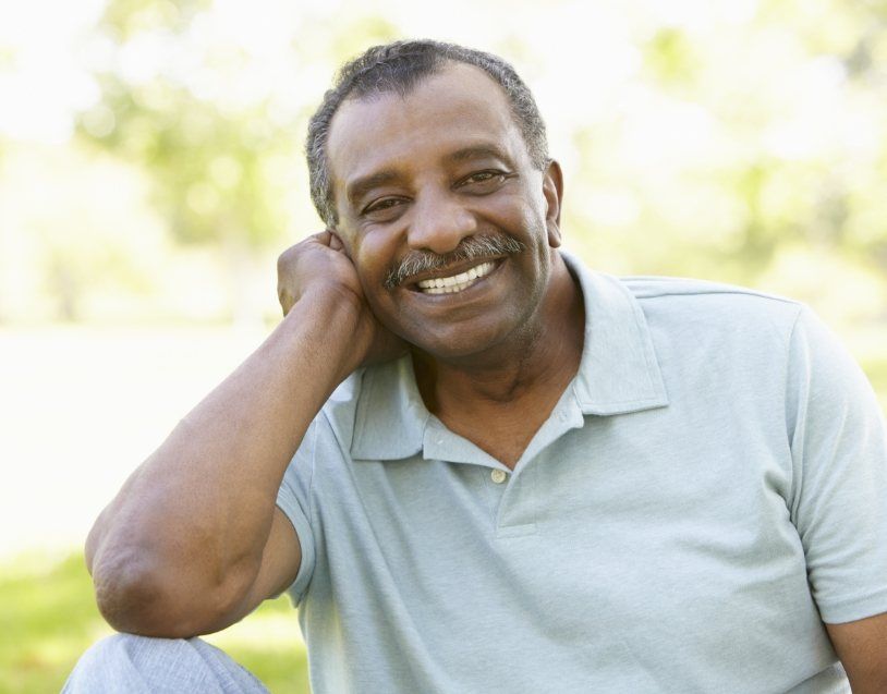 Man with healthy smile after gum disease treatment