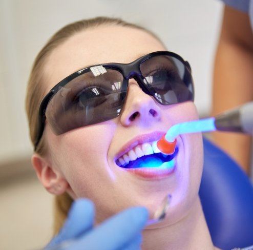 Patient receiving dental sealants