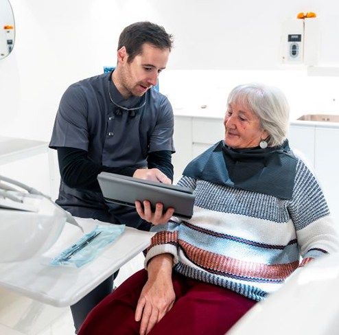 Dentist and patient talking during consultation