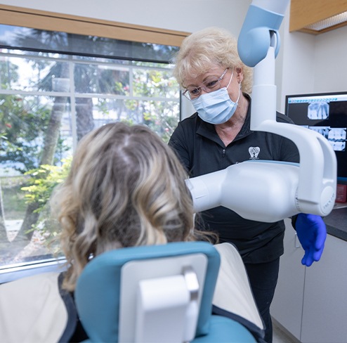 Dentist using intraoral camera to capture smile photos