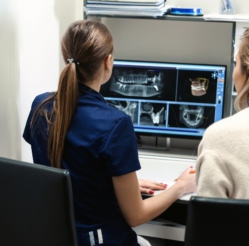 Dental team members reviewing digital x-rays
