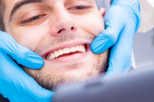 Man smiling during dental appointment