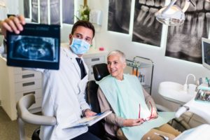 Dentist showing patient their X-rays