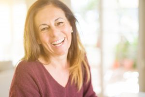 Woman smiling while sitting