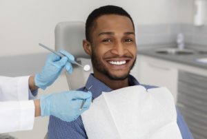 Man smiling in dental chair