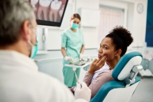 Woman with jaw pain in dental chair