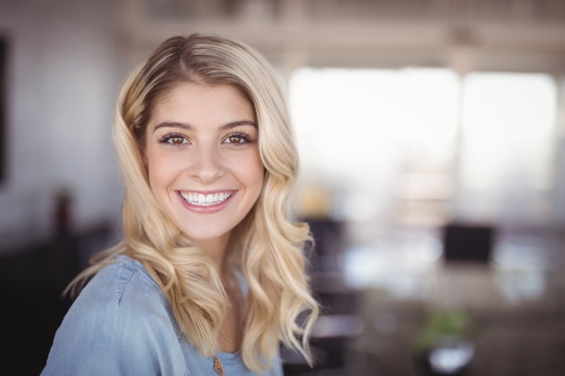 person with dental implants smiling