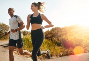 Two people jogging outdoors.